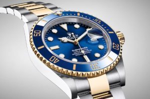 Rolex 18k gold submariners include the yellow gold with a blue bezel