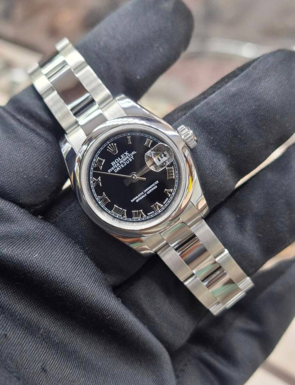 Pre-owned Rolex Lady-Datejust 179160 with black dial and steel case